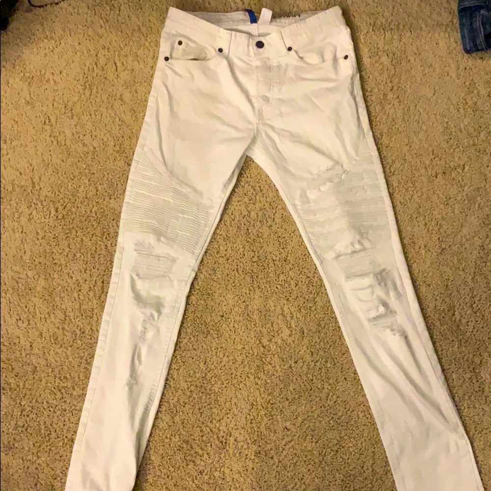Ripped white moto jeans